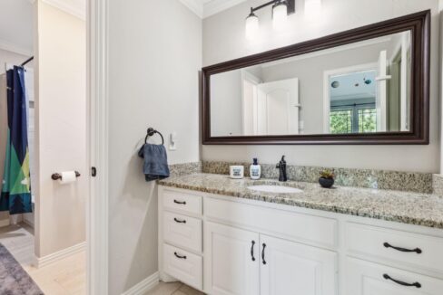 2413 Versailles Drive Heath, TX bathroom with large mirror