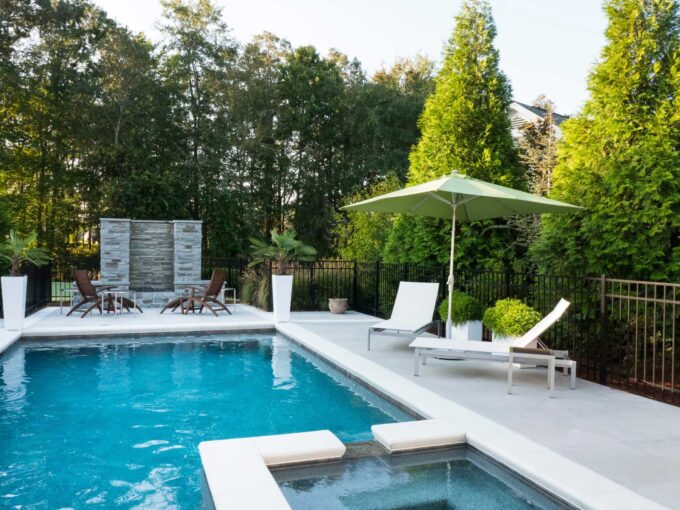 building a pool in back yard blue pool with umbrella